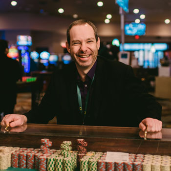 Man smiling at Wildhorse Casino Table Game